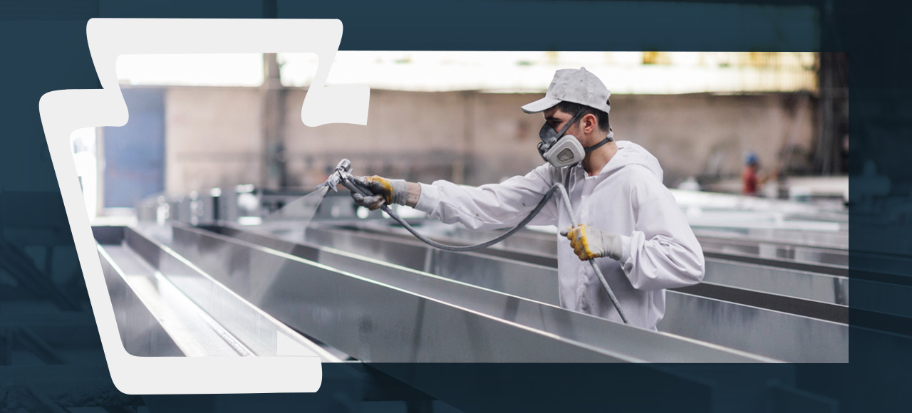 a man is powder coating a surface