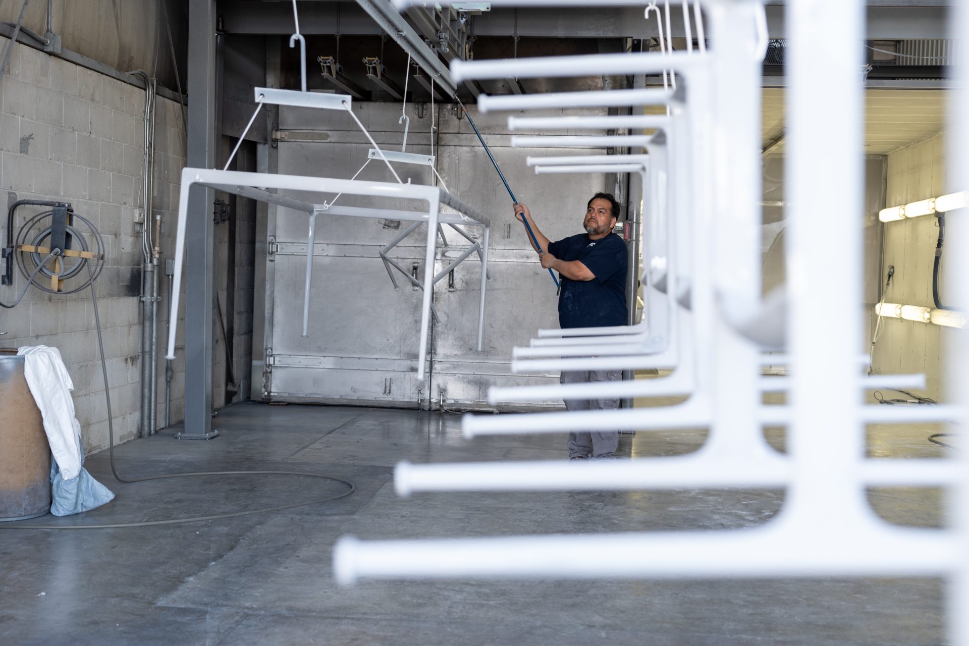 Keystone Koating employee examining product coating