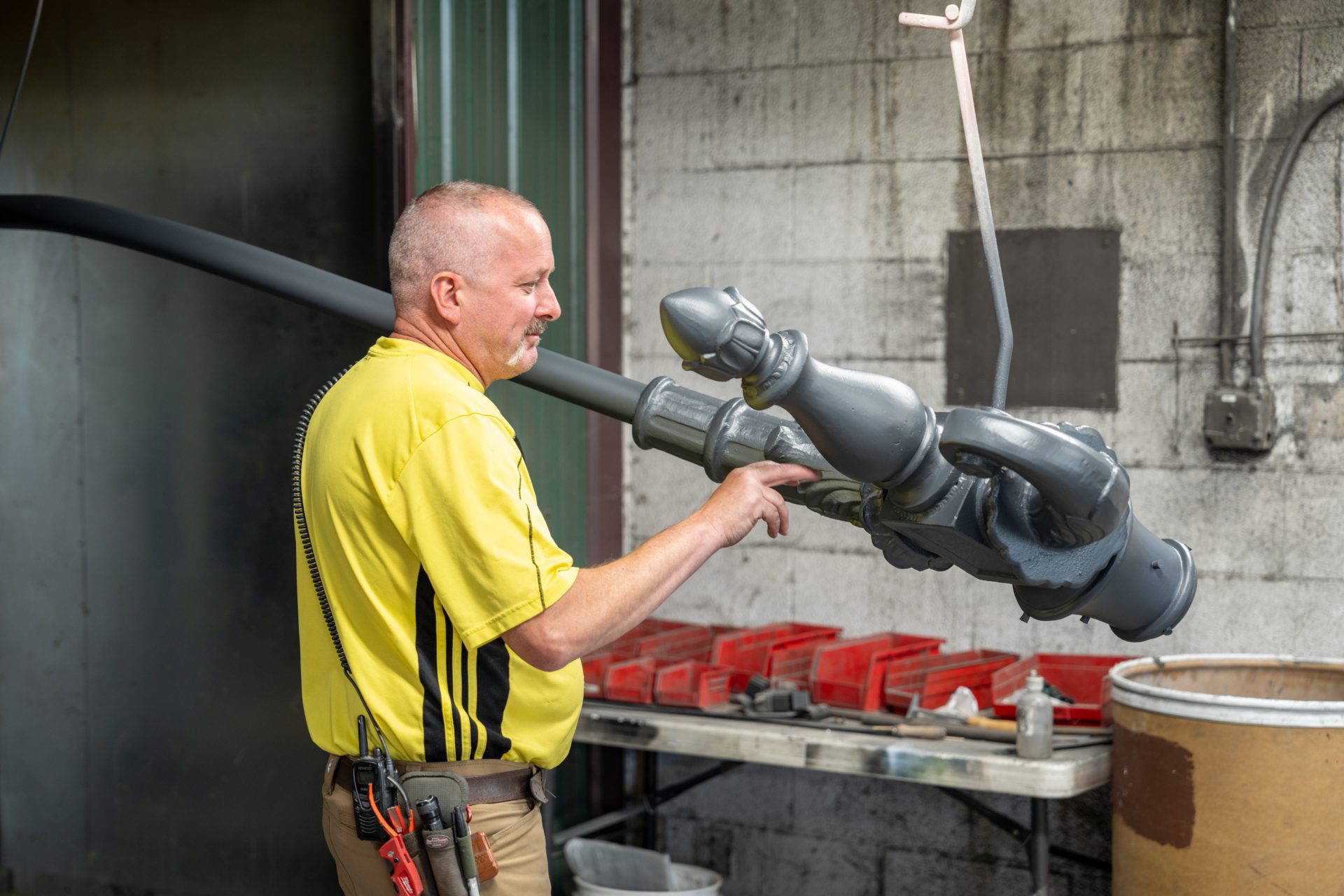Side angle of Keystone Koating employee performing quality control testing