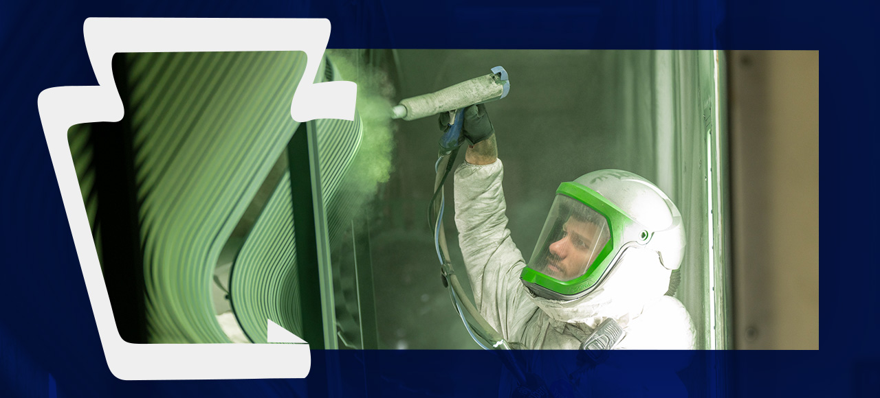 Keystone Koating employee applying powder coating